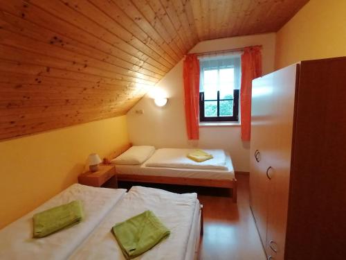 Postel nebo postele na pokoji v ubytování Chalupa Sluníčko