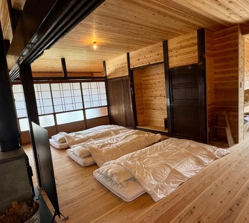 Postel nebo postele na pokoji v ubytování くらし伊根大原