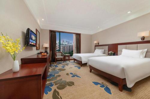 Dong Cheng Hotelにあるベッド