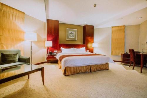 Letto o letti in una camera di Shanxi World Trade Hotel