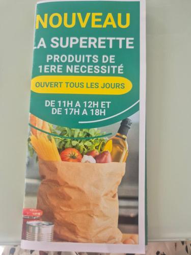 a sign in a refrigerator with a bag of food at Mobil-Home N 48 in Fourmies