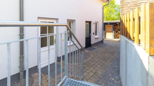an empty hallway of a building with a staircase at Haus Seeblick mit 9 Wohnungen in Alt Reddevitz