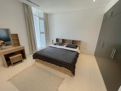 Voodi või voodid majutusasutuse Sea View Appartment Seeb toas