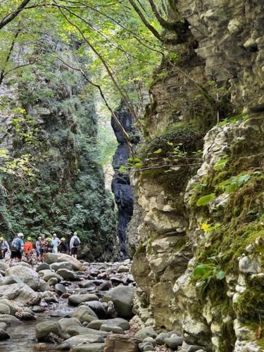 a group of people walking down a rocky road at Palazzo Modafi in Bagni di Lucca