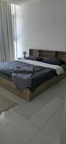 a bed sitting in a room with at Sea View Appartment Seeb in Ḩayl Āl ‘Umayr