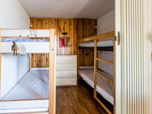 two bunk beds in a room with wooden walls at Studio divisible proche pistes, 4 pers., parking, belle vue - FR-1-329-5 in Bellentre