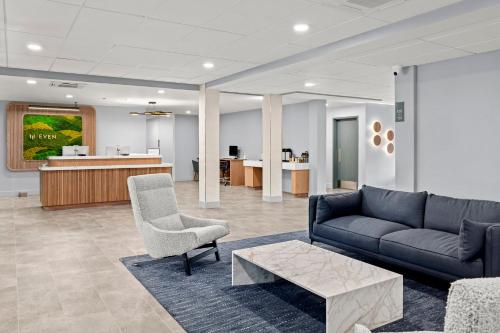 a living room with a couch and a chair at EVEN Hotel Portland - Beaverton by IHG in Portland