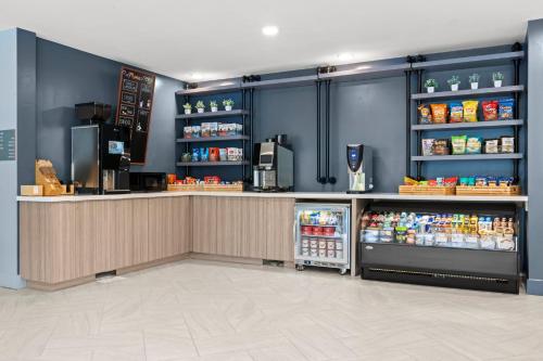 a grocery store with a counter and a refrigerator at EVEN Hotel Portland - Beaverton by IHG in Portland