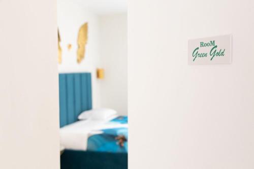 a room with a bed with a sign that reads hawk guest club at Da Giuseppina in Ercolano