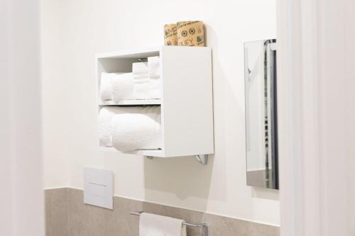 a bathroom with rolls of toilet paper and a mirror at Da Giuseppina in Ercolano
