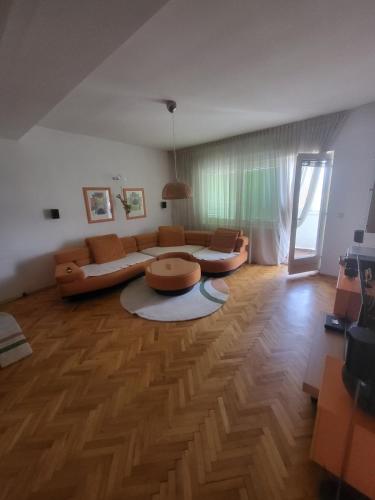 a living room with a couch and a table at Dimoski Apartment in Prilep