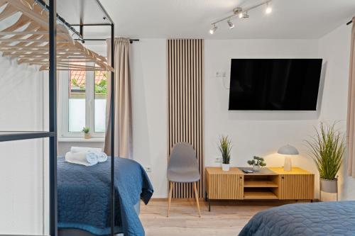 Μια τηλεόραση ή/και κέντρο ψυχαγωγίας στο WINETIME - Apartment Edenkoben - für bis zu 3 Personen - gemütlich an der südlichen Weinstraße zwischen Landau und Neustadt - nähe Villa Ludwigshöhe - Rietburg
