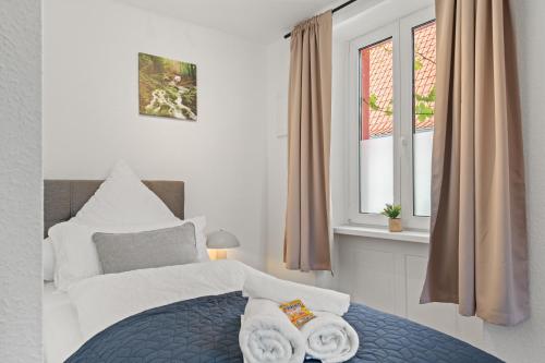 Ένα ή περισσότερα κρεβάτια σε δωμάτιο στο WINETIME - Apartment Edenkoben - für bis zu 3 Personen - gemütlich an der südlichen Weinstraße zwischen Landau und Neustadt - nähe Villa Ludwigshöhe - Rietburg