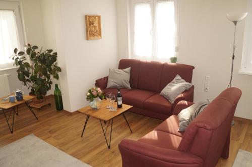 a living room with a couch and a table at Ferienwohnung Schelklewiese in Baiersbronn