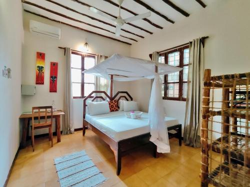 Postel nebo postele na pokoji v ubytování Hakuna Matata Villa