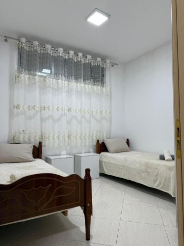 Кровать или кровати в номере Albas Home