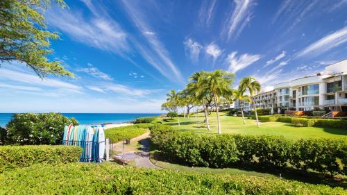 a view of the beach from the balcony of a resort at ❤PiH❤ Hapuna Surfside Beachfront Steps From Ocean B26 in Hapuna Beach