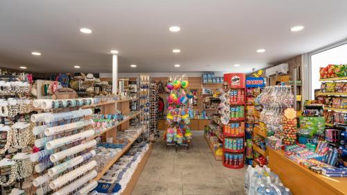 a store aisle with a large amount of merchandise at Grand Blue Beach Hotel in Kardamaina