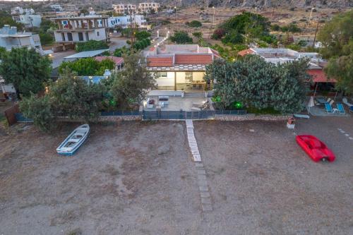 an aerial view of a house with a boat in a yard at Villa Perla in Lardos