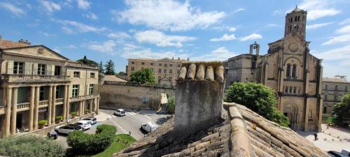 a view from the roof of a building with a church at Boutique Hôtel Entraigues in Uzès