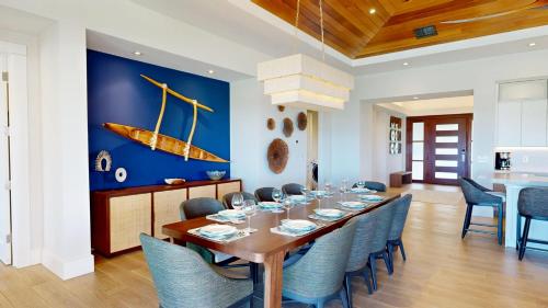 a dining room with a table with chairs and a boat on the wall at ❤PiH❤ Hale Moana Heated Private Pool Spa Detached Ohana Suite in Waimea