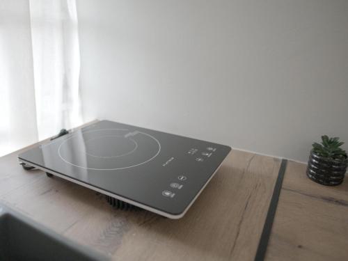 a laptop computer sitting on top of a wooden table at Insolam Accommodation in Mokopane