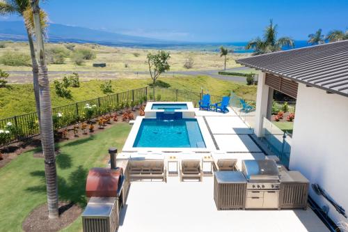 an overhead view of a swimming pool in a backyard at BLUE SERENITY Luxurious home in private community with Heated Private Pool Spa Detached Ohana Suite in Waimea