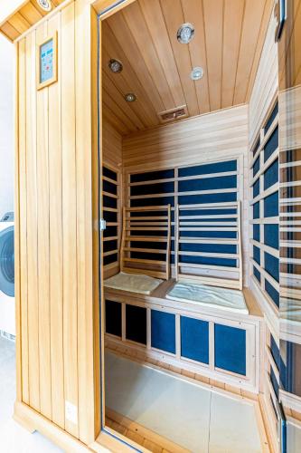 a sauna with a window in a room at Laguna Fuchaku in Onna