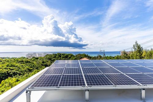 a solar array on the roof of a house at Laguna Fuchaku in Onna