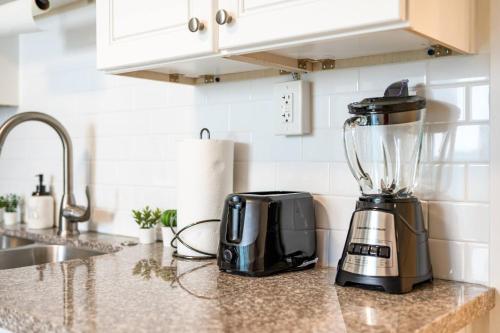a blender sitting on a counter in a kitchen at 1 Block to Beach Heaven Chic 2BD in Manhattan Beach