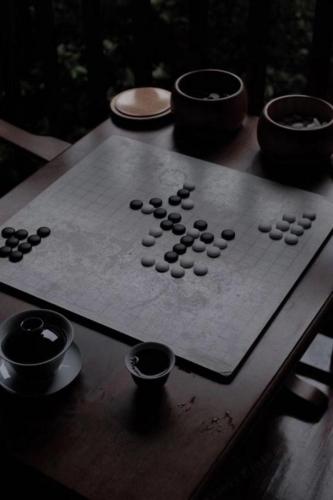 a board on a table with bowls on it at Lijiang Old Town Anyu hotel in Lijiang