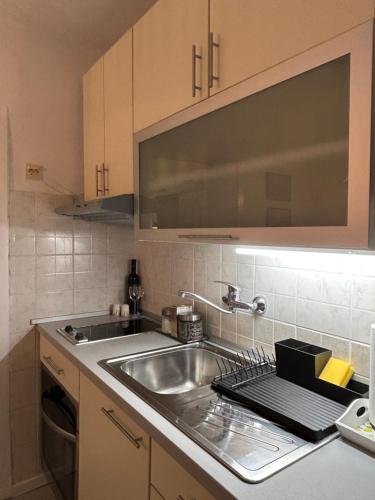 Η κουζίνα ή μικρή κουζίνα στο Apartman Angie