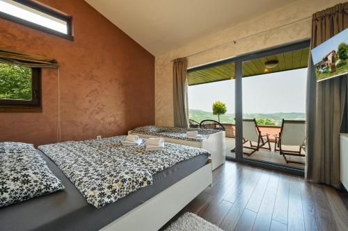 Postel nebo postele na pokoji v ubytování DIVINUS HOLIDAY HOUSE