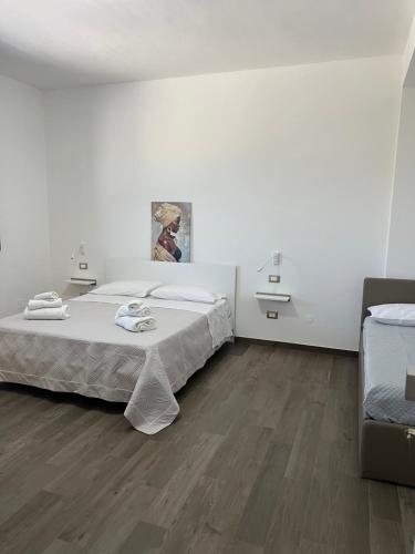 Postel nebo postele na pokoji v ubytování kalispera