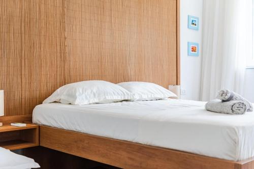 Ένα ή περισσότερα κρεβάτια σε δωμάτιο στο Talea Joyful Stay