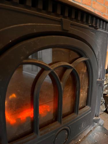 a fire inside of a wood stove at Ubytování na pevnosti in Olomouc