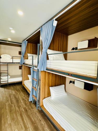 a group of bunk beds in a room at NinhBinh Buffalo Hostel in Vũ Lâm