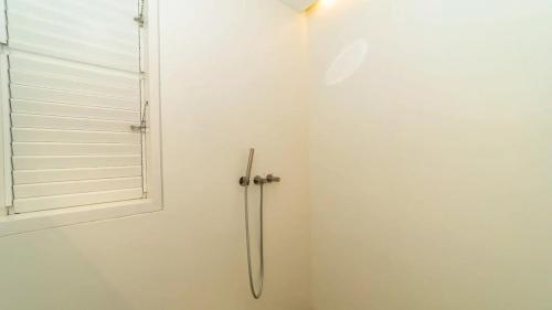 a shower stall in a bathroom with a window at Luxury Villa with Ocean View in St Barts in Saint-Jean