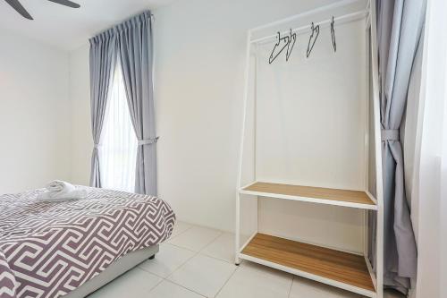 Ένα ή περισσότερα κρεβάτια σε δωμάτιο στο Family Adventure Homestay in Cameron Highlands Clover Home 6-30