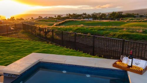 a swimming pool with a view of a golf course at HOKU LANI HOUSE Heated Private Pool Spa Intro Pricing 25% off in Waimea