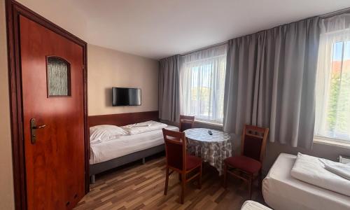 Un pat sau paturi într-o cameră la City Hostel