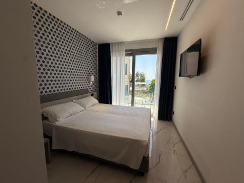 Katil atau katil-katil dalam bilik di Hotel Villa Levi