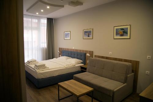 A seating area at AquaSun Family Hotel