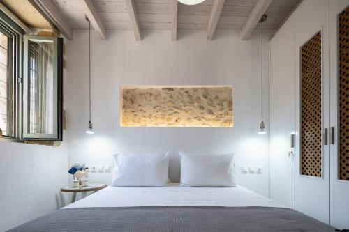 Кровать или кровати в номере Villa Manmar, Tradition & Comfort Blend by etouri