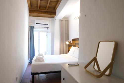 Postel nebo postele na pokoji v ubytování Wine Apartments Florence Aleatico