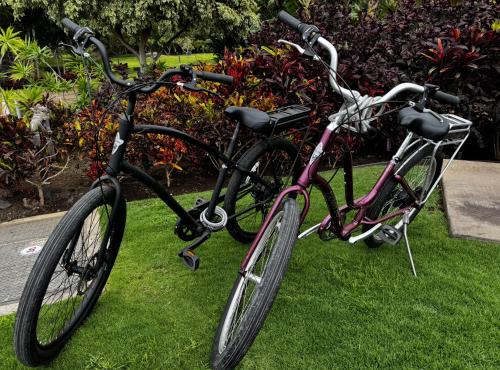 two bikes parked next to each other on the grass at ❤PiH❤ BLUE TRANQUILITY Heated Private Pool Spa Detached Ohana Suite in Waimea