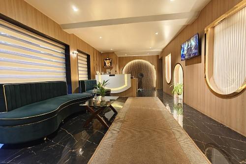 a living room with a couch and a table at The Golden Arc in Pune