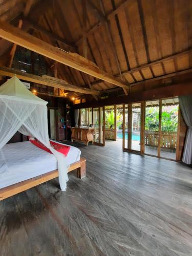 Una cama o camas en una habitación de Ubud Virgin Villa