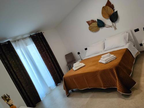 Ένα ή περισσότερα κρεβάτια σε δωμάτιο στο I TRAMONTI DEL GOLFO - Rooms & Luxury apartment