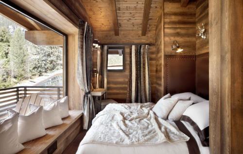 Ένα ή περισσότερα κρεβάτια σε δωμάτιο στο Chalet Alta